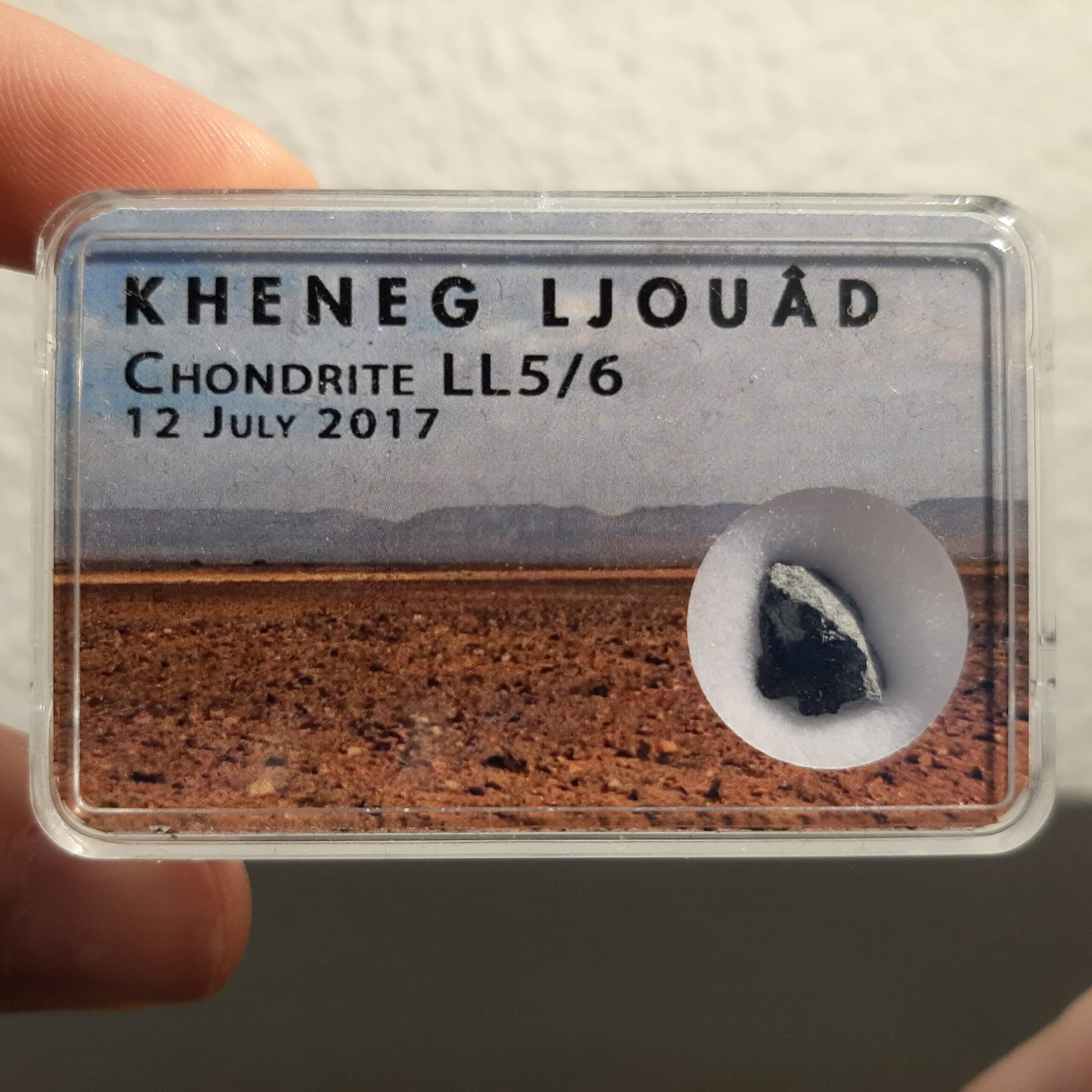 Kheneg Ljouad meteorite. LL5/6 chondrite in box.
