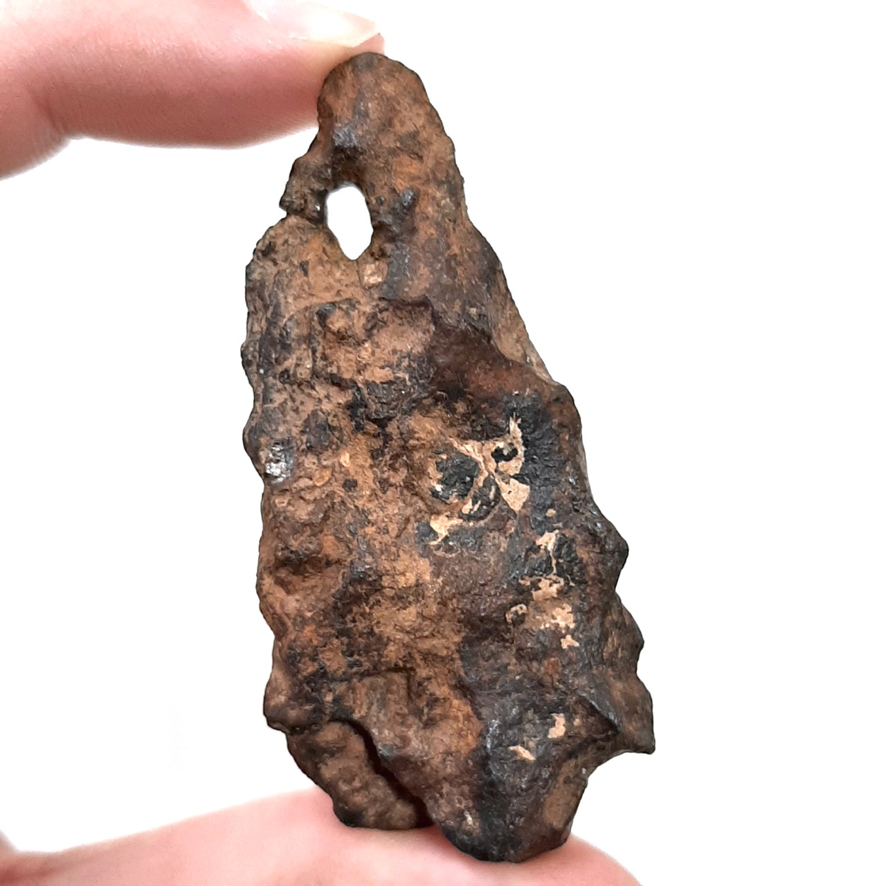 Agoudal meteorite with 2 holes.